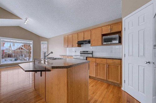 522 Evermeadow Road Sw, Calgary, AB - Indoor Photo Showing Kitchen With Double Sink