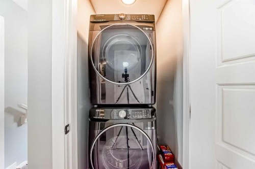 29 Precedence Glen, Cochrane, AB - Indoor Photo Showing Laundry Room