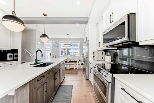 29 Precedence Glen, Cochrane, AB - Indoor Photo Showing Kitchen With Double Sink With Upgraded Kitchen