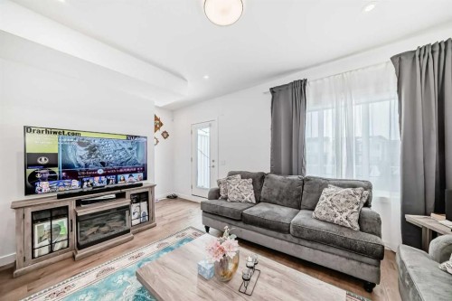 604-280 Chelsea Road, Chestermere, AB - Indoor Photo Showing Living Room