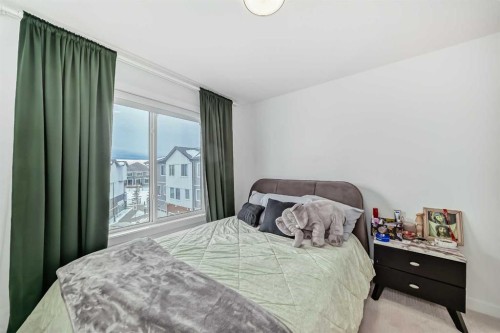 604-280 Chelsea Road, Chestermere, AB - Indoor Photo Showing Bedroom