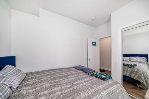 604-280 Chelsea Road, Chestermere, AB - Indoor Photo Showing Bedroom
