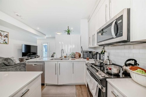 604-280 Chelsea Road, Chestermere, AB - Indoor Photo Showing Kitchen With Double Sink