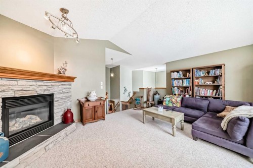 199 Mt Brewster Circle Se, Calgary, AB - Indoor Photo Showing Living Room With Fireplace