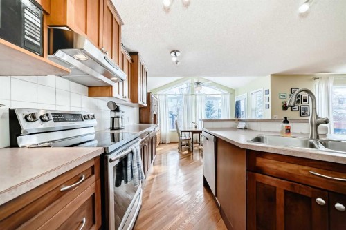 199 Mt Brewster Circle Se, Calgary, AB - Indoor Photo Showing Kitchen With Double Sink