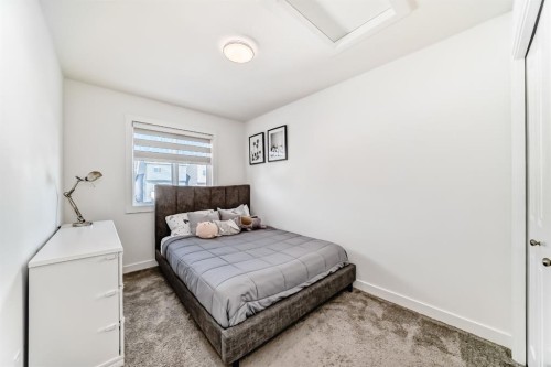 81 Herron Mews Ne, Calgary, AB - Indoor Photo Showing Bedroom