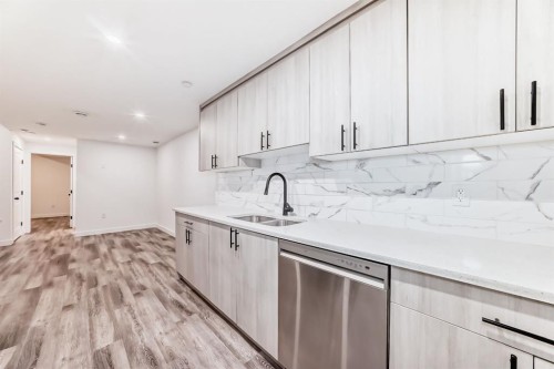 81 Herron Mews Ne, Calgary, AB - Indoor Photo Showing Kitchen With Double Sink With Upgraded Kitchen
