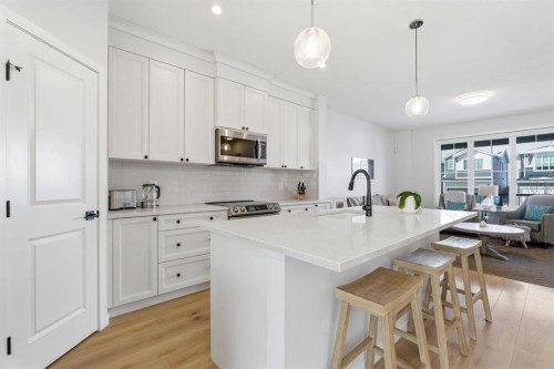 359 Fireside Way, Cochrane, AB - Indoor Photo Showing Kitchen With Upgraded Kitchen