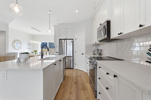 359 Fireside Way, Cochrane, AB - Indoor Photo Showing Kitchen With Stainless Steel Kitchen With Upgraded Kitchen