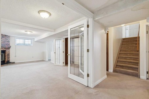 6820 4 Avenue Se, Calgary, AB - Indoor Photo Showing Other Room With Fireplace