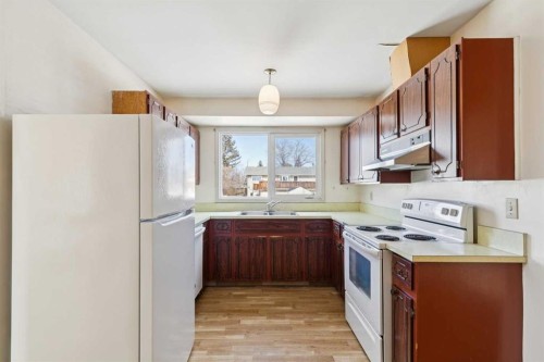 6820 4 Avenue Se, Calgary, AB - Indoor Photo Showing Kitchen With Double Sink