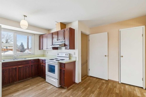 6820 4 Avenue Se, Calgary, AB - Indoor Photo Showing Kitchen With Double Sink