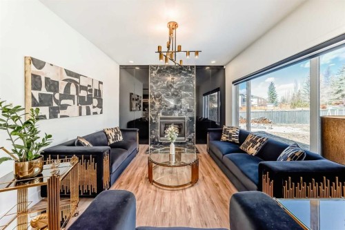 630 Rocky Ridge View Nw, Calgary, AB - Indoor Photo Showing Living Room With Fireplace