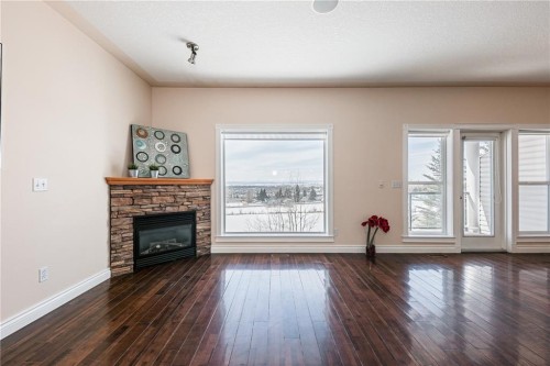 144 Rocky Vista Terrace Nw, Calgary, AB - Indoor Photo Showing Living Room With Fireplace