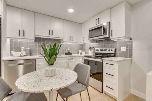 142 Belmont Passage Sw, Calgary, AB - Indoor Photo Showing Kitchen With Upgraded Kitchen