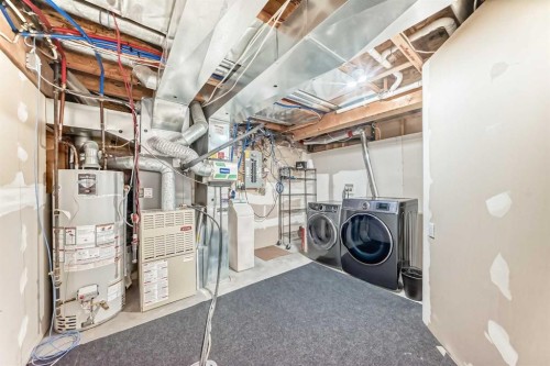 668 Scimitar Bay Nw, Calgary, AB - Indoor Photo Showing Laundry Room