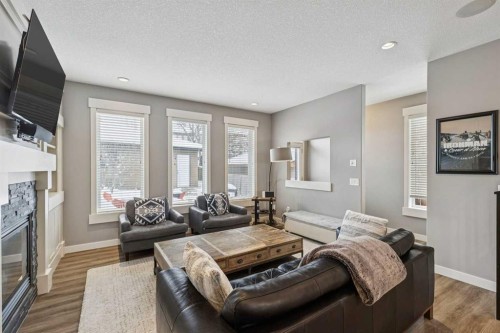 4936 20 Avenue Nw, Calgary, AB - Indoor Photo Showing Living Room With Fireplace