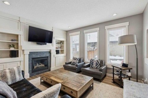4936 20 Avenue Nw, Calgary, AB - Indoor Photo Showing Living Room With Fireplace