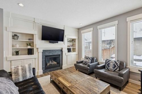 4936 20 Avenue Nw, Calgary, AB - Indoor Photo Showing Living Room With Fireplace