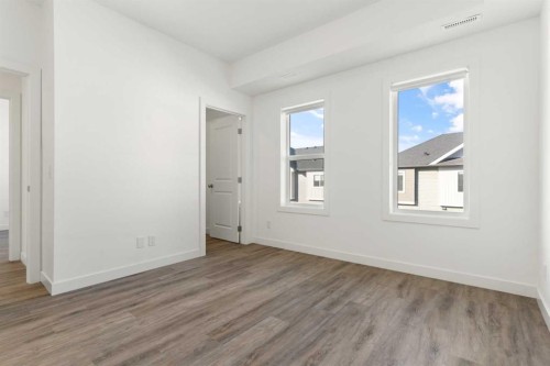 602-24 Rivercrest Drive, Cochrane, AB - Indoor Photo Showing Other Room