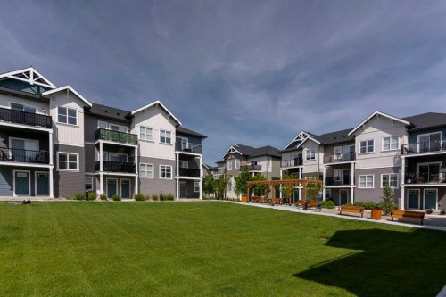 602-24 Rivercrest Drive, Cochrane, AB - Outdoor With Facade