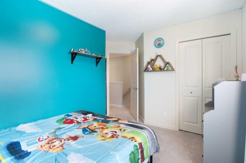 31 Sunset Link, Cochrane, AB - Indoor Photo Showing Bedroom
