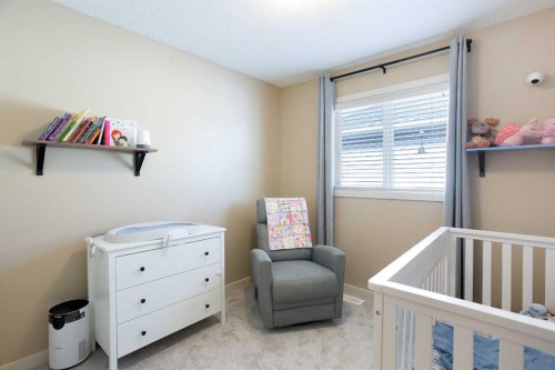 31 Sunset Link, Cochrane, AB - Indoor Photo Showing Bedroom