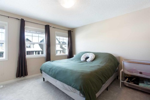 31 Sunset Link, Cochrane, AB - Indoor Photo Showing Bedroom