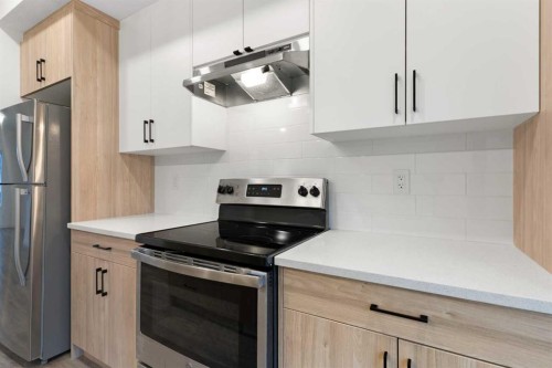 103-24 Rivercrest Drive, Cochrane, AB - Indoor Photo Showing Kitchen