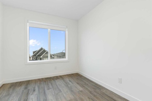 103-24 Rivercrest Drive, Cochrane, AB - Indoor Photo Showing Other Room