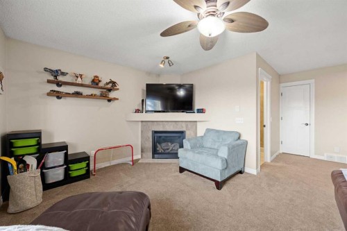 164 West Lakeview Circle, Chestermere, AB - Indoor Photo Showing Living Room With Fireplace