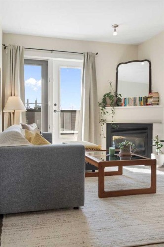 406-830 Centre Avenue Ne, Calgary, AB - Indoor Photo Showing Living Room With Fireplace