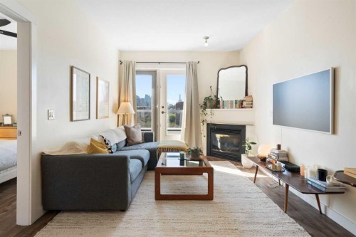 406-830 Centre Avenue Ne, Calgary, AB - Indoor Photo Showing Living Room With Fireplace