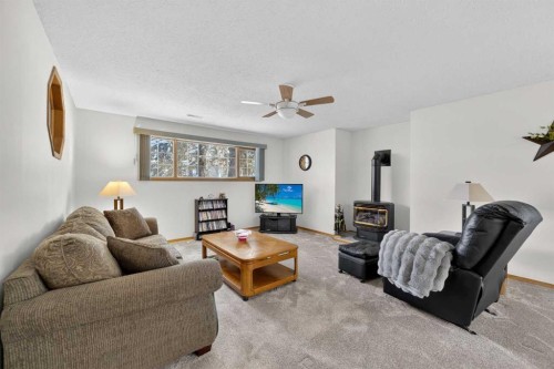 159 Balsam Crescent, Olds, AB - Indoor Photo Showing Living Room With Fireplace