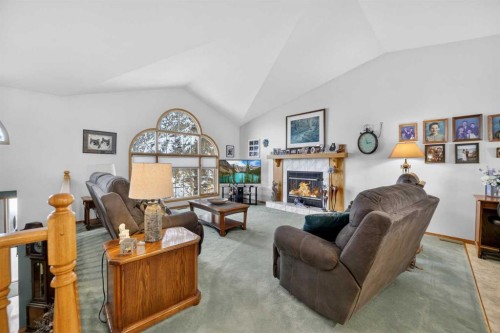 159 Balsam Crescent, Olds, AB - Indoor Photo Showing Living Room With Fireplace