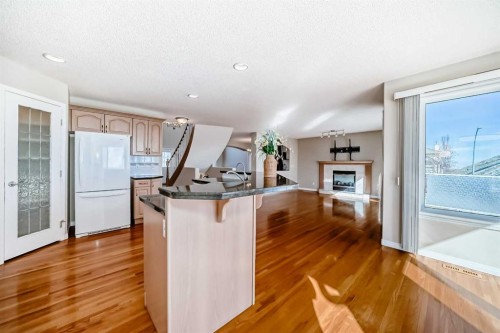 300 Hampstead Road Nw, Calgary, AB - Indoor Photo Showing Kitchen With Fireplace
