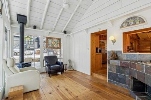 4 Pine Avenue, Bragg Creek, AB - Indoor With Fireplace