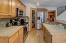 182 Harvest Creek Close Ne, Calgary, AB  - Indoor Photo Showing Kitchen With Double Sink 