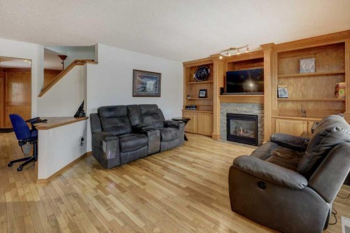 182 Harvest Creek Close Ne, Calgary, AB - Indoor Photo Showing Living Room With Fireplace