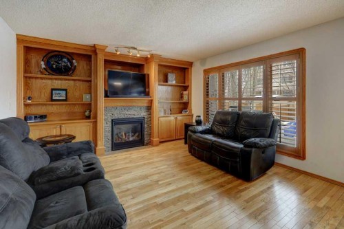 182 Harvest Creek Close Ne, Calgary, AB - Indoor Photo Showing Living Room With Fireplace