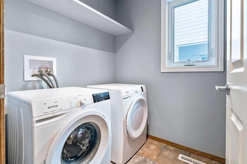 303 Schubert Place Nw, Calgary, AB - Indoor Photo Showing Laundry Room