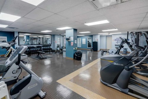 203-345 Rocky Vista Park Nw, Calgary, AB - Indoor Photo Showing Gym Room
