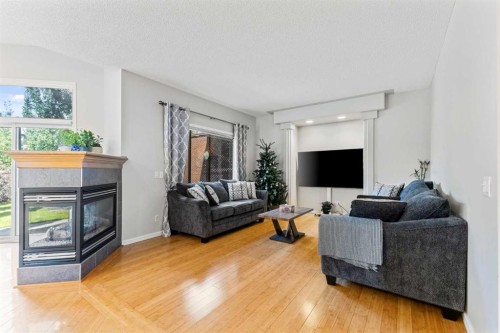 11 Simcoe Crescent Sw, Calgary, AB - Indoor Photo Showing Living Room With Fireplace