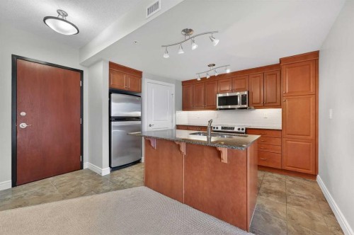 1402-910 5 Avenue Sw, Calgary, AB - Indoor Photo Showing Kitchen With Stainless Steel Kitchen