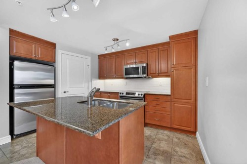 1402-910 5 Avenue Sw, Calgary, AB - Indoor Photo Showing Kitchen With Stainless Steel Kitchen With Double Sink