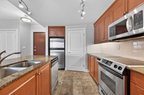 1402-910 5 Avenue Sw, Calgary, AB - Indoor Photo Showing Kitchen With Stainless Steel Kitchen With Double Sink