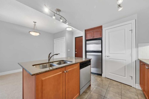 1402-910 5 Avenue Sw, Calgary, AB - Indoor Photo Showing Kitchen With Double Sink