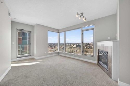 1402-910 5 Avenue Sw, Calgary, AB - Indoor With Fireplace