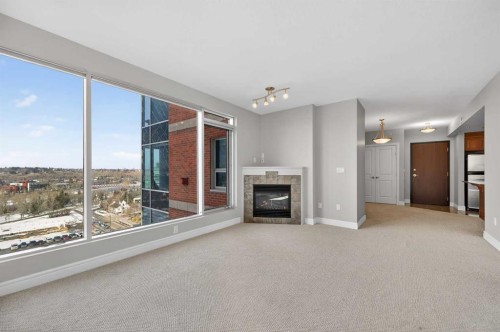 1402-910 5 Avenue Sw, Calgary, AB - Indoor With Fireplace