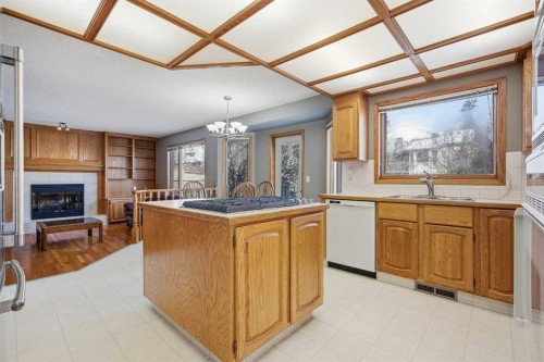 146 Hawkdale Circle Nw, Calgary, AB - Indoor Photo Showing Kitchen With Fireplace